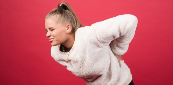 Боль в спине посередине